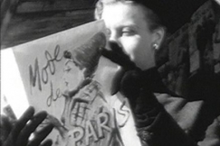 Kuva: Nainen lukee ranskalaista muotilehte�. YLE kuvanauha. 