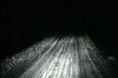 Kuva: Auto ajaa pime�ll� maantiell�. (1971) YLE kuvanauha.